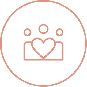 Village Clubs Camelback logo: line icon of three people with a heart, symbolizing community and support within a circular border.