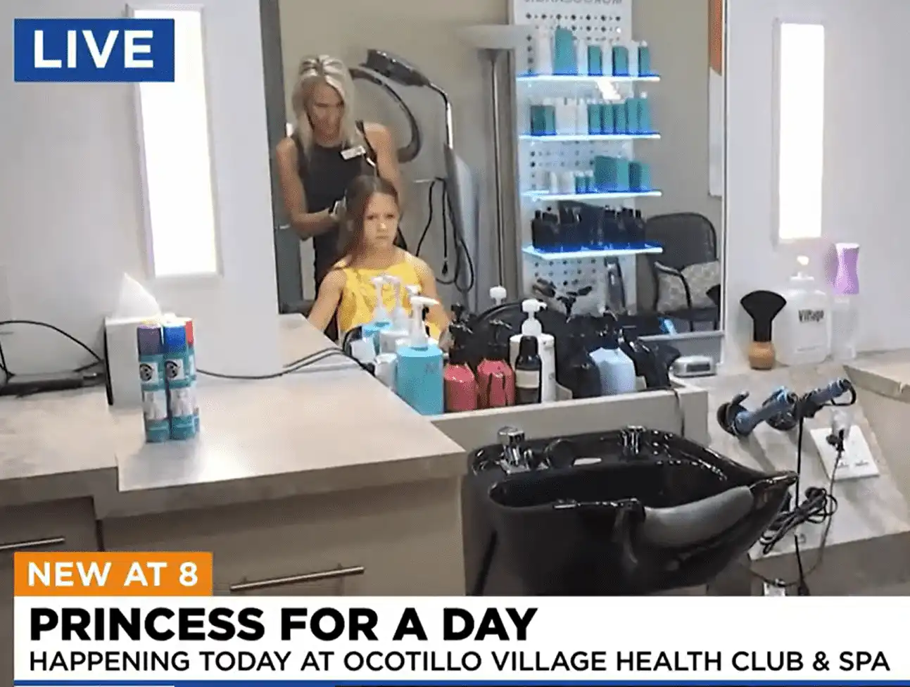 A girl gets her hair styled at Village Clubs Ocotillo salon, with products on the counter during a “Princess for a Day” event.